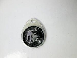 Leo horoscope pendant with black background, teardrop shaped, for man or woman. (photo taken on a white background)