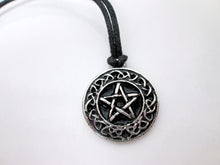 Load image into Gallery viewer, close up front view of Celtic pentacle pendant necklace, round pendant with black background, on black cord, for unisex teen or adult. (photo taken on a white background)