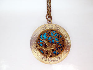 Glow in the dark bird locket necklace
