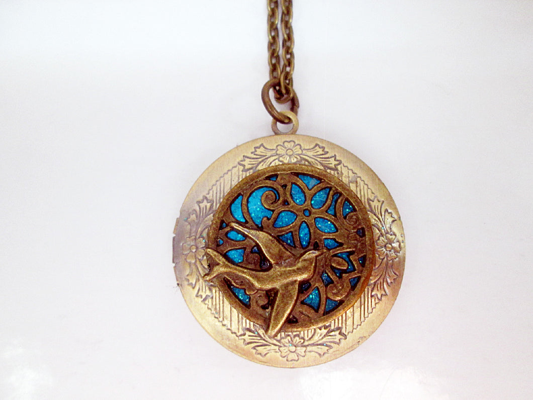 Glow in the dark bird locket necklace