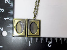 Load image into Gallery viewer, inside view of small book locket