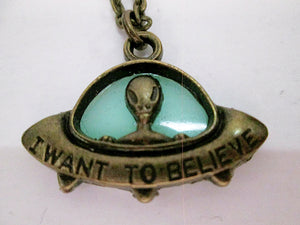 green glowing spaceship necklace