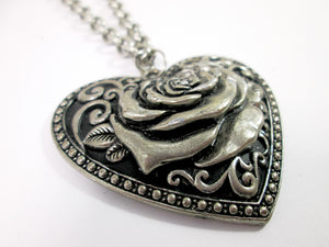 closeup of punk heart rose necklace