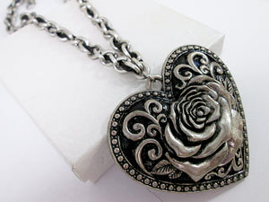 closeup of large heart rose neckace