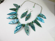 Load image into Gallery viewer, side view of teal shell leaf necklace and earrings set
