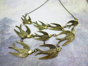 antique bronze flock of sparrows necklace