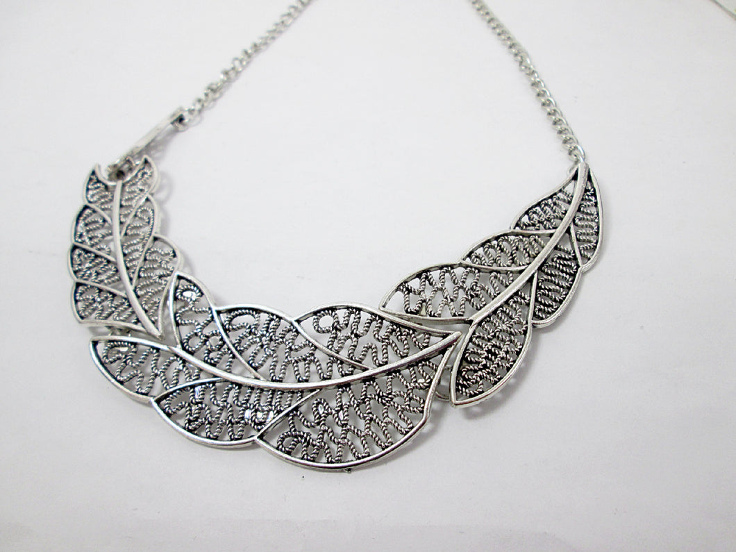 silver filigree leaf sideways necklace