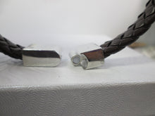 Load image into Gallery viewer, black braided leather cuff bracelet opens with sliding clasp.