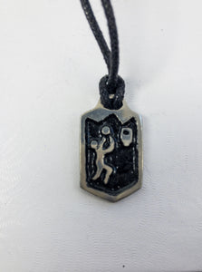 basketball player charm pendant necklace, six-sided polygon pendant  with black background, on black cord, for unisex teen or adult.