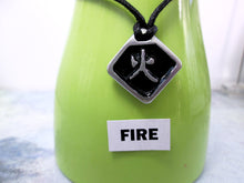 Load image into Gallery viewer, Kanji symbol for element of fire pendant necklace, pendant with black background, necklace on black cord.