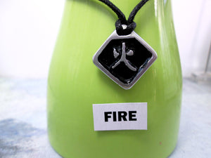 Kanji symbol for element of fire pendant necklace, pendant with black background, necklace on black cord.