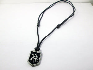 full view of handmade pewter horse rider pendant necklace, pendant with black background, on black cord, for men or women. (photo taken of necklace on a white background)