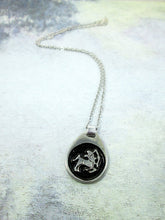 Load image into Gallery viewer, Sagittarius horoscope pendant necklace on metal chain, teardrop pendant with black background, for man or woman. (picture taken on a grey background)