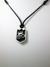 Load image into Gallery viewer, cycling pendant necklace, biker pendant necklace, pendant with black background, on black cord, for unisex teen or adult. (photo taken on a white background)