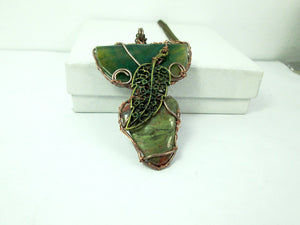 wire wrapped green stone pendant