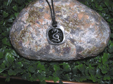 Load image into Gallery viewer, Year of the snake Chinese zodiac pendant necklace for unisex, squarish pendant with black background, cotton cord style. (picture taken on a background with a rock)