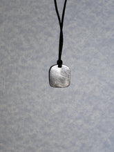 Load image into Gallery viewer, showing back of zodiac pendant on black cord, pendant polished to mirror finish.