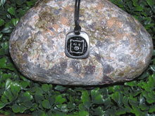 Load image into Gallery viewer, Year of the pig Chinese zodiac pendant necklace for unisex, squarish pendant with black background, cotton cord style. (picture taken on a background with a rock)