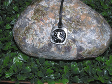 Load image into Gallery viewer, Year of the sheep or goat or ram, Chinese zodiac animal sign pendant necklace for unisex, squarish pendant with black background, cotton cord style. (picture taken on a background with a rock)