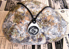 Load image into Gallery viewer, Pisces horoscope pendant necklace on black cord, teardrop pendant with black background, for man or woman. (picture taken on background with a rock)