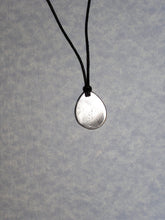 Load image into Gallery viewer, showing back of Aries horoscope necklace pendant, teardrop shape, on black cord. For man or woman. 