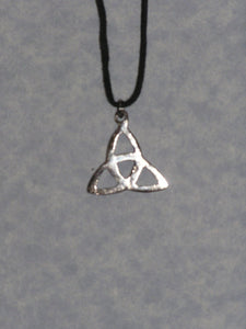 back view of Celtic Trinity Knot pendant necklace, on black cord, for unisex teen or adult. (photo taken on a gray background)