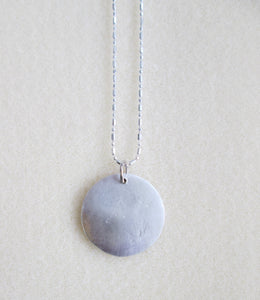 back view of pendant showing pendant polished to mirror finish.