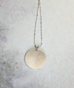 back of pendant, showing pendant polished to mirror finish.