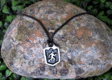 Load image into Gallery viewer, handmade pewter marathon runner or jogger pendant necklace, pendant wit black background, on black cord, for men or women. (picture of necklace taken on a background with a rock)