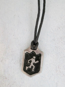 handmade pewter marathon runner or jogger pendant necklace, pendant wit black background, on black cord, for men or women.