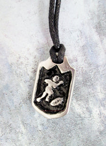 handmade pewter football player pendant necklace, pendant with black background, on black cord, for man or woman.
