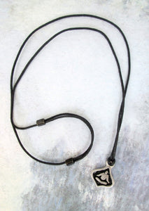 handmade pewter yoga lotus pendant necklace, pendant with black background, on black cord, for men or women.