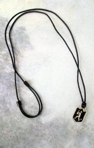 full view of baseball player pendant necklace with black background, on black cord for unisex teen or adult.