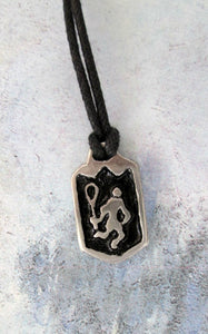 handmade pewter lacrosse player pendant necklace, pendant with black background, on black cord, for man or woman