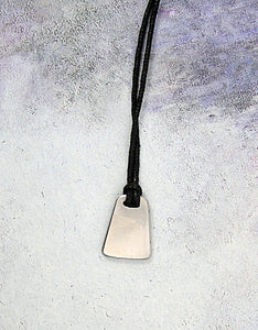 back view of hockey goalie pendant on black cord, pendant polished to mirror finish.