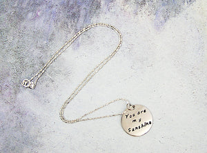 handmade and hand stamped message pendant necklace "You are my sunshine"