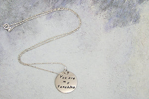 handmade and hand stamped message pendant necklace "You are my sunshine"