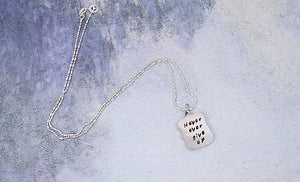 hand stamped message necklace "never ever give up"