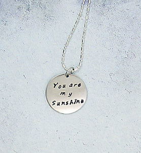 handmade and hand stamped message pendant necklace "You are my sunshine" 