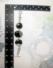 Load image into Gallery viewer, Large green-black agate stone statement bracelet alongside with a black L shape ruler for size and measurement reference.