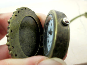 close up view of photo locket watch necklace