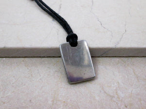 back view of IT computer geek pendant on black cord.  Picture showing pendant polished to mirror finish.