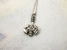 Load image into Gallery viewer, far view of handmade pewter Celtic axe pendant necklace, double blade, double sided. for man or women. pendant on metal chain. (photo taken on a gray background)